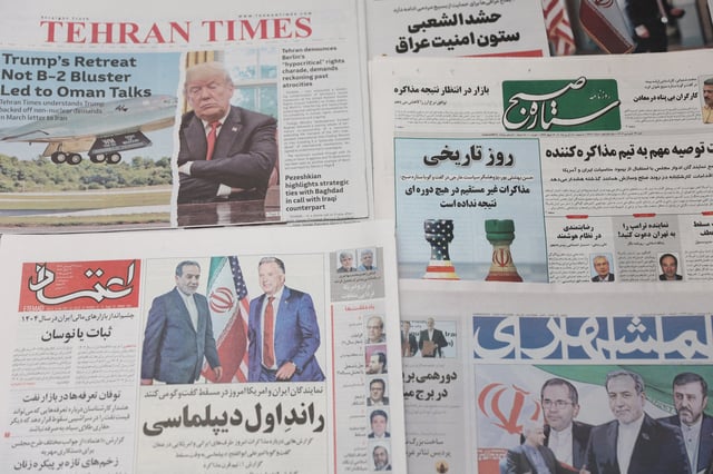An Iranian newspaper with a cover photo of Iran's Foreign Minister Abbas Araqchi and U.S. Middle East envoy Steve Witkoff, is seen in Tehran, Iran, April 12, 2025. Majid Asgaripour/WANA (West Asia News Agency) via REUTERS/ File Photo