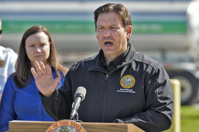 FILE - Florida Gov. Ron DeSantis holds a news conference at a fuel depot in Plant City, Fla., Oct. 12, 2024, accompanied by Florida Attorney General Ashley Moody, right. (AP Photo/Chris O'Meara, file)