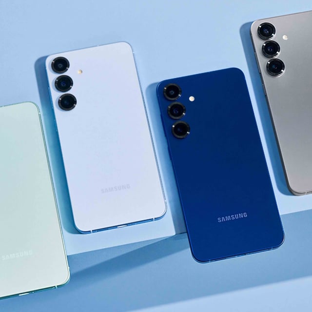four colors of the samsung galaxy s25 lined up on a light blue surface