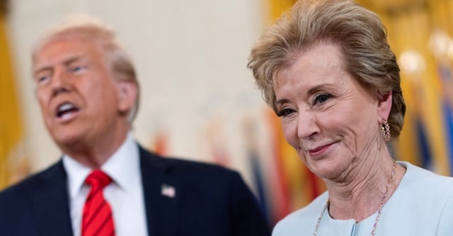 FILE PHOTO: U.S. Secretary of Education Linda McMahon smiles during the signing event for an executive order to shut down the Department of Education next to U.S. President Donald Trump, in the East Room at the White House in Washington, D.C., U.S., March 20, 2025. REUTERS/Carlos Barria/File Photo
