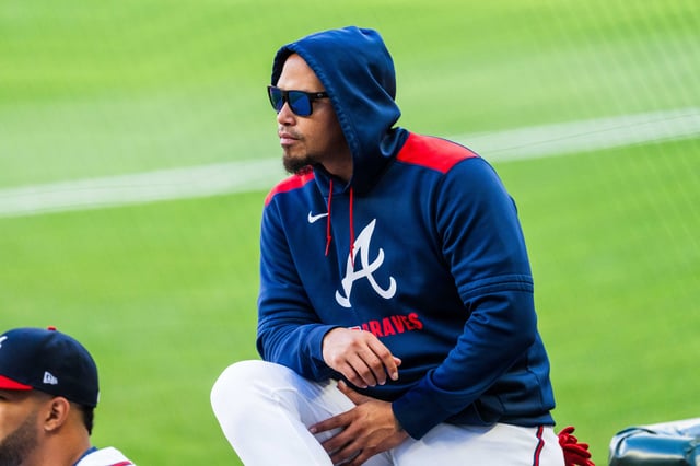 ATLANTA, GA - MAY 04: Orlando Arcia #11 of the Atlanta Braves wears sunglasses in the dugout in the first inning against the Los Angeles Dodgers at Truist Park on May 4, 2025 in Atlanta, Georgia.
