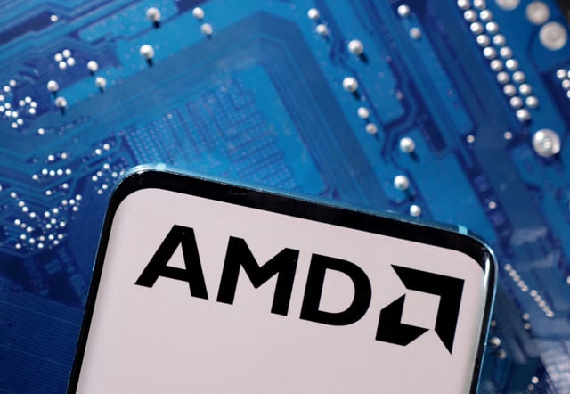 A smartphone with a displayed AMD logo is placed on a computer motherboard in this illustration taken March 6, 2023. REUTERS/Dado Ruvic/Illustration/File Photo