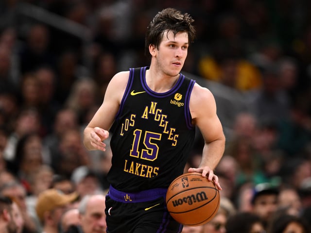 Austin Reaves #15 of the Los Angeles Lakers dribbles the ball during the second quarter of a game against the Boston Celtics at the TD Garden on February 01, 2024 in Boston, Massachusetts.