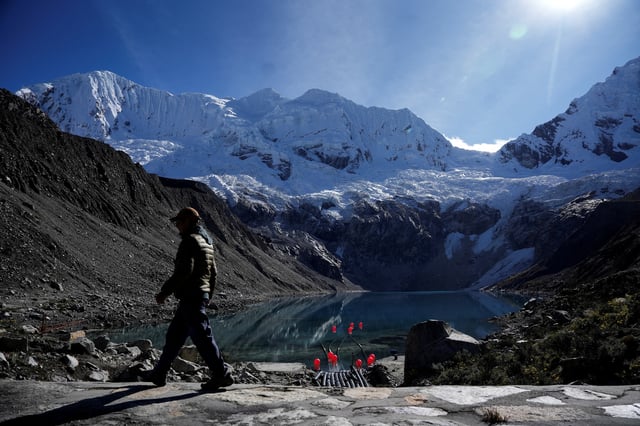 Peruvian farmer Saul Luciano Lliuya, who is suing German energy utility RWE, arguing that the company's emissions have contributed to the melting of Andean glaciers, walks in front of  Palcacocha Lake, before the verdict of the high regional German court in Hamm, in Huaraz, Peru May 27, 2025. REUTERS/Angela Ponce/File Photo