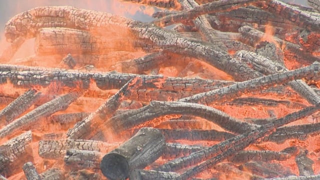FILE. A photo of a pile of wood being burned.