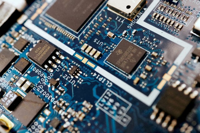 Semiconductor chips are seen on a circuit board of a computer in this illustration picture taken February 25, 2022. REUTERS/Florence Lo/Illustration/File Photo