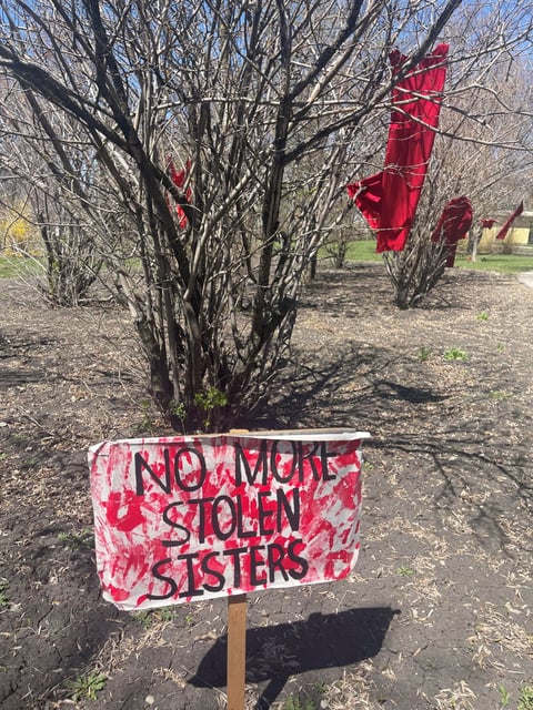  An appeal for change and red dresses decorating the trail at the Altona Centennial Park.