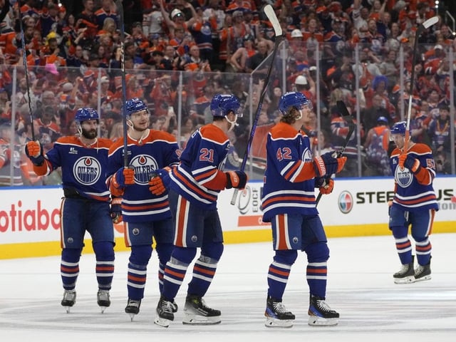 Members of the Edmonton Oilers wave to the crowd after defeating the Dallas Stars 4-1 in Game 4 during the third round of the Stanley Cup playoffs on Tuesday, May 27, 2025, in Edmonton.  