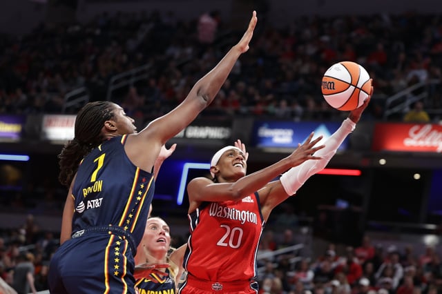 Brittney Sykes #20 of the Washington Mystics shoots the ball past Aliyah Boston #7 of the Indiana Fever during the first half at Gainbridge Fieldhouse on May 3, 2025 in Indianapolis, Indiana.