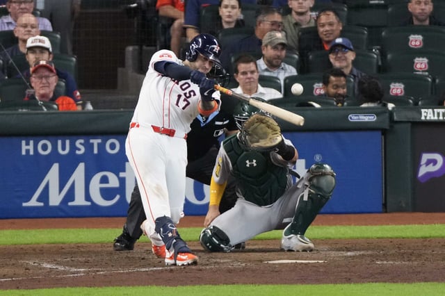 Houston Astros Victor Caratini (17) hits a 2-RBI single to take a 5-3 lead in the seventh inning of an MLB baseball game in Houston, Wednesday, May 28, 2025.