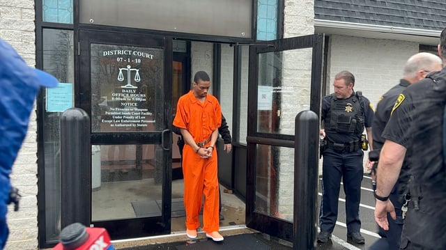 Andre Gordon Jr., who faces first-degree murder charges in the shooting deaths of his stepmother, sister and the mother of his children, exits the Bucks County court after appearing for a preliminary hearing, Wednesday, April 3, 2024, in Fallsington, Pa. The judge denied bail and the district attorney said she would seek the death penalty. Asked if he had any comment, Gordon said &#34;Pray, pray to God.&#34; (AP photo/Mike Catalini)