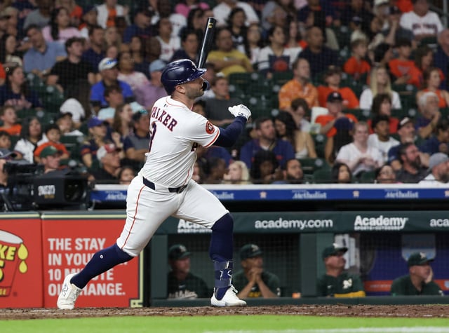 May 27, 2025; Houston, Texas, USA; Houston Astros first baseman Christian Walker (8) hits a two-run home run against the Athletics in the sixth inning at Daikin Park. Mandatory Credit: Thomas Shea-Imagn Images