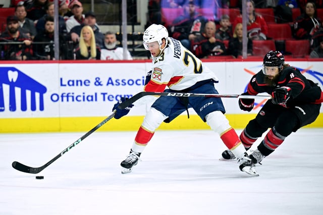 Brent Burns #8 of the Carolina Hurricanes defends Carter Verhaeghe #23 of the Florida Panthers during the first period of the game at PNC Arena on February 22, 2024 in Raleigh, North Carolina.