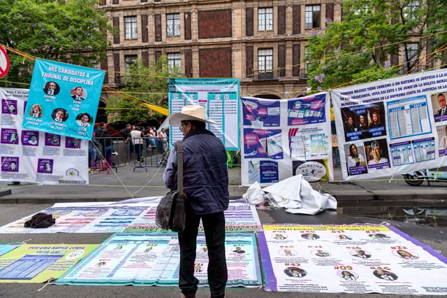 Posters displaying candidate and election information in front of the Supreme Court of Justice of the Nation in Mexico City, Mexico, on Tuesday, May 27, 2025. Mexican voters for the first time will elect their judges in a process involving thousands of little-known candidates that could drastically change the balance of power in the country. Photographer: Stephania Corpi/Bloomberg via Getty Images
