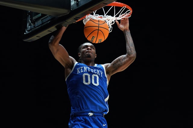Mar 28, 2025; Indianapolis, IN, USA; Kentucky Wildcats guard Otega Oweh (00) dunks the ball against the Tennessee Volunteers in the second half during a Midwest Regional semifinal of the 2025 NCAA tournament at Lucas Oil Stadium. Mandatory Credit: Robert Goddin-Imagn Images
