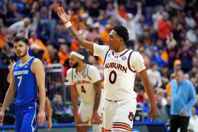 Mar 22, 2025; Lexington, KY, USA;  Auburn Tigers guard Tahaad Pettiford (0) celebrates during the second half against the Creighton Bluejays in the second round to the NCAA Tournament at Rupp Arena. Mandatory Credit: Aaron Doster-Imagn Images
