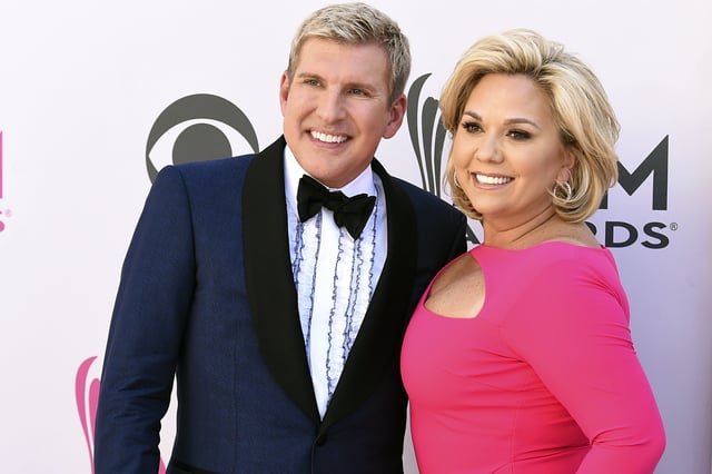 FILE – Todd Chrisley, left, and his wife, Julie Chrisley, pose for photos at the 52nd annual Academy of Country Music Awards on April 2, 2017, in Las Vegas. Reality TV star Julie Chrisley’s sentence for bank fraud and tax evasion has been thrown out by federal appeals judges, who have ordered a lower court to redo her punishment, Friday, June 21, 2024.