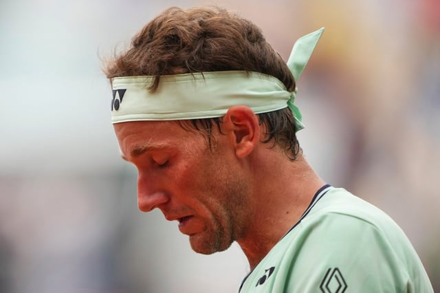 Seventh-seeded Casper Ruud looks down as he plays Nuno Borges during their second-round match of the French Tennis Open on Wednesday, May 28, 2025, in Paris, . (AP Photo/Lindsey Wasson)