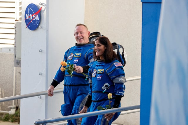 NASA astronauts Butch Wilmore and Suni Williams walk at NASA's Kennedy Space Center, ahead of Boeing's Starliner-1 Crew Flight Test (CFT) mission on a United Launch Alliance Atlas V rocket to the International Space Station, in Cape Canaveral, Florida, U.S., June 5, 2024. REUTERS/Joe Skipper/File Photo