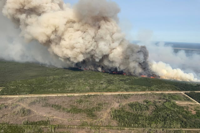 Smoke rises from wildfire WE023 near Wanless, Manitoba, Canada May 27, 2025. Manitoba Government/Handout via REUTERS/File Photo