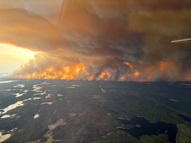 Smoke rises from wildfire WE024 which has prompted a pre-evacuation notice in Flin Flon, Manitoba, Canada May 27, 2025. Manitoba Government/Handout via REUTERS