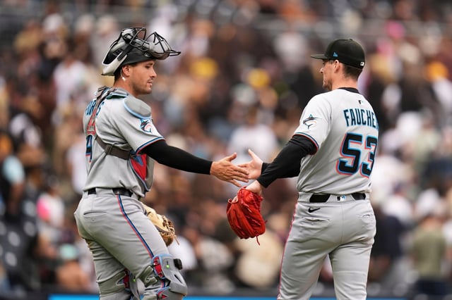 Miami reliever Calvin Faucher and catcher Nick Fortes celebrate after the Marlins won 10-8 on Wednesday afternoon in San Diego. (AP Photo/Gregory Bull)