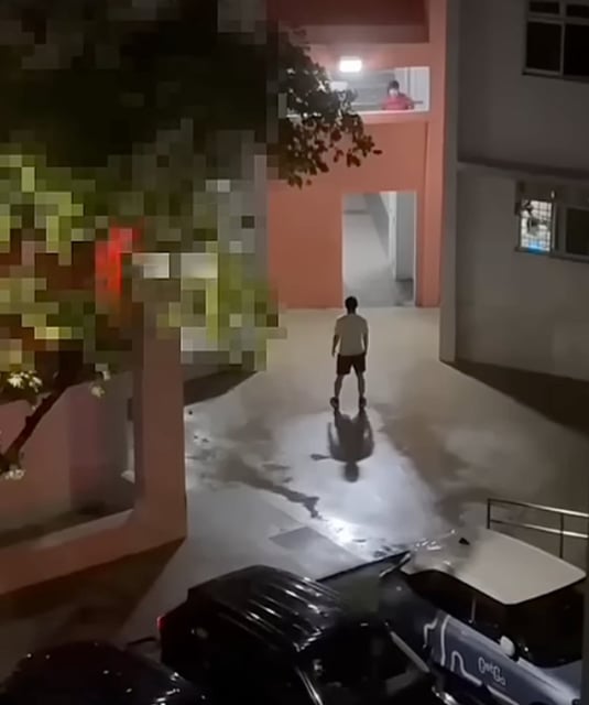Video footage online shows the man standing near a car park as his wife harangues him from a balcony. Photo: Instagram/tiagong_sg