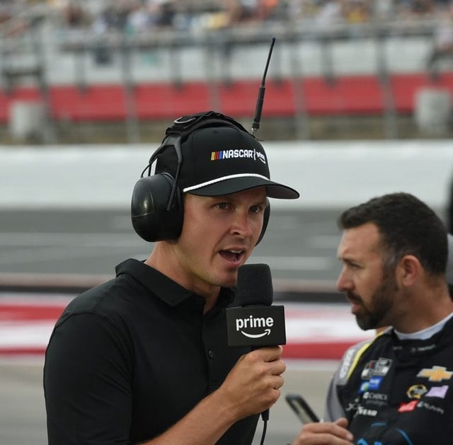 CHARLOTTE, NC - MAY 25: Trevor Bayne, pit reporter for Amazon Prime looks on prior to the running of the NASCAR Cup Series Coca-Cola 600 on May 25, 2025, at Charlotte Motor Speedway in Charlotte, NC. (Photo by Jeffrey Vest/Icon Sportswire)