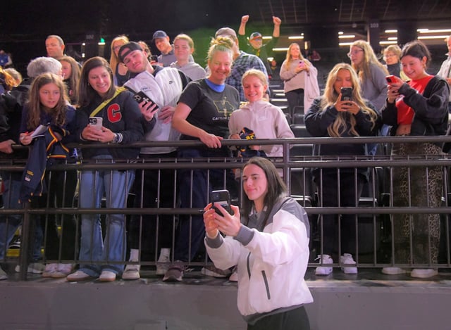 Indiana Fever guard Caitlin Clark poses with fans before the game with the Washington Mystics in WNBA basketball in Baltimore. (Karl Merton Ferron/Staff)