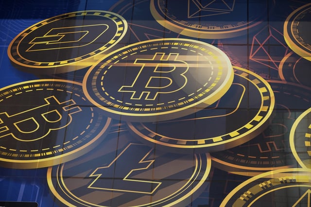 FILE - An advertisement for the cryptocurrency, Bitcoin, is displayed on a building in Hong Kong on Nov. 18, 2021. (AP Photo/Kin Cheung, File)