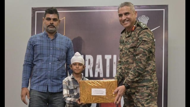 Major General Ranjit Singh Manral, GOC, 7th Infantry Division, felicitating Shravan Singh in Ferozepur. (HT photo)