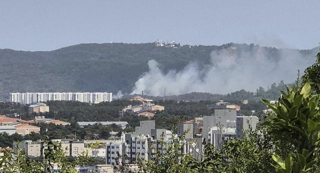 Smoke rises from a mountain in Pohang, South Korea, where a Navy patrol plane carrying four people crashed on Thursday, May 29, 2025. (Son Dae-seong/Yonhap via AP)