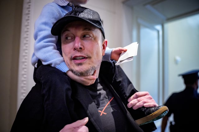 Elon Musk and his son X Æ arrive for a meeting with Senate Committee on Commerce, Science, and Transportation members at the U.S.