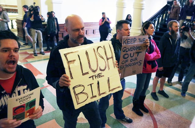 Protestors chant in the hall as Lt. Governor Dan Patrtick announces legislation by Senator Lois Kolkhorst (R-Brenham) concerning bathroom access rules in Texas on January 5, 2017.
