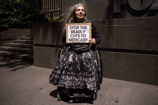 A protester at a weekly rally outside the News Corporation headquarters in New York City on May 20, 2025. 