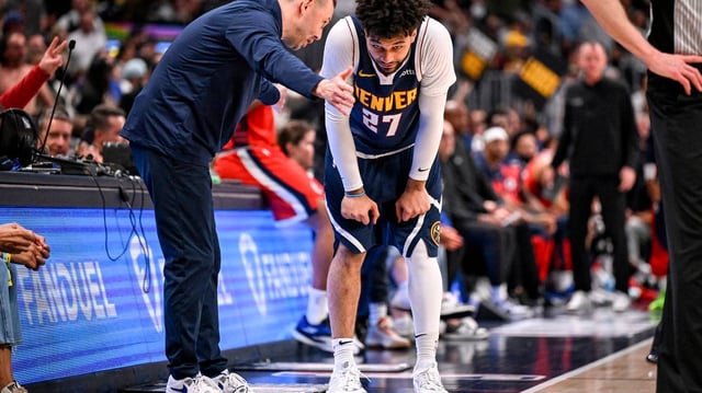 Head coach David Adelman of the Denver Nuggets speaks with Jamal Murray (27) during the fourth quarter of the LA Clippers’ 105-102 win at Ball Arena in Denver on Monday, April 21, 2025. (AAron Ontiveroz/The Denver Post/TNS)