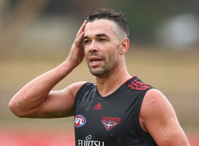 MELBOURNE, AUSTRALIA - JANUARY 20:  Ryan Crowley of the Bombers walks the boundary during an Essendon Bombers AFL training session at True Value Solar Centre on January 20, 2016 in Melbourne, Australia.  (Photo by Robert Cianflone/Getty Images)