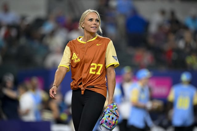 Jul 13, 2024; Arlington, TX, USA; USA softball Olympian Jennie Finch (27) of the American League looks on as she pitches against the National League during the 2024 All Star Celebrity Softball Game at Globe Life Field. Mandatory Credit: Jerome Miron-USA TODAY Sports/File Photo