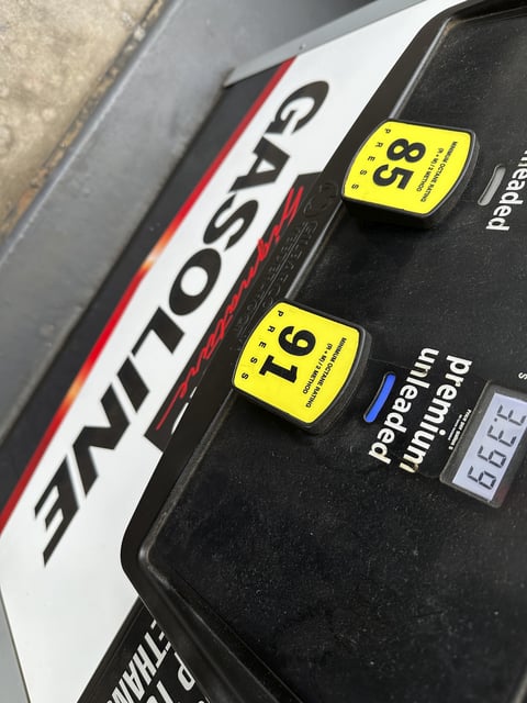 FILE - The per-gallon price is illuminated on the pump at a Costco warehouse gasoline station Tuesday, April 1, 2025, in Thornton, Colo. (AP Photo/David Zalubowski, File)
