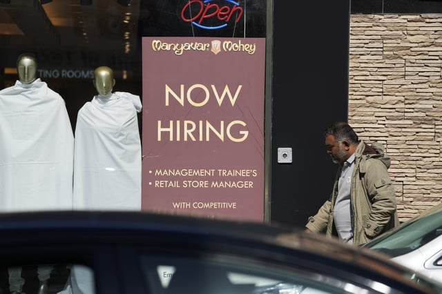 FILE - A hiring sign is displayed at a retail store in Chicago on Monday, March 11, 2024. (AP Photo/Nam Y. Huh, File)