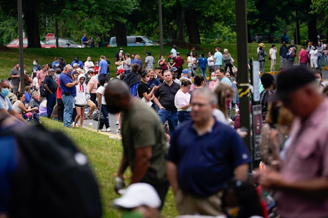 Hundreds of people line up outside a Kentucky Career Center hoping to find assistance with their unemployment claim in Frankfort, Kentucky, U.S. June 18, 2020. REUTERS/Bryan Woolston/File Photo
