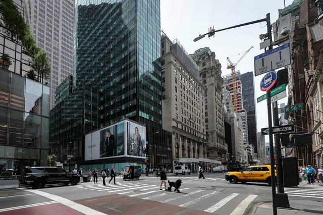 Pedestrians walk past a retail space at 715-717 Fifth Avenue in New York City, U.S., May 27, 2025. REUTERS/Jeenah Moon/File Photo