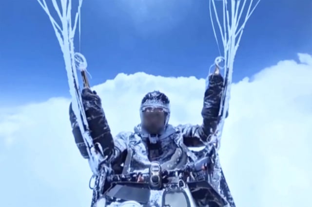 Chinese paraglider Peng Yujiang survives accidental 8,000-metre-high flight above the clouds.