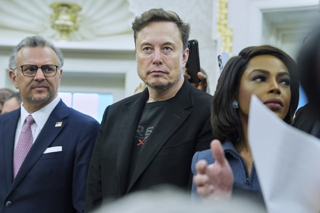 Elon Musk looks on as President Donald Trump meets South African President Cyril Ramaphosa in the Oval Office of the White House, Wednesday, May 21, 2025, in Washington. 