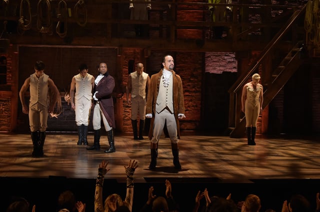 Actor Leslie Odom, Jr. (L) and actor, composer Lin-Manuel Miranda (R) perform on stage during "Hamilton" GRAMMY performance for The 58th GRAMMY Awards at Richard Rodgers Theater on February 15, 2016 in New York City.