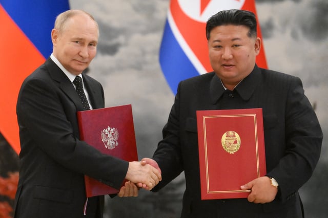 In this pool photograph distributed by the Russian state agency Sputnik, Russian President Vladimir Putin (L) shakes hands with North Korea&#39;s leader Kim Jong Un (R) after a signing ceremony following their bilateral talks at Kumsusan state residence in Pyongyang, on June 19, 2024.