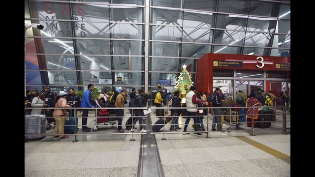New Delhi, India - Dec. 30, 2019: Passengers queue to enter the airport after several flights were delayed due to dense fog, at Terminal 3, IGI Airport, in New Delhi, India, on Monday, December 30, 2019. (Photo by Sanjeev Verma / Hindustan Times) (Sanjeev Verma/HT PHOTO)