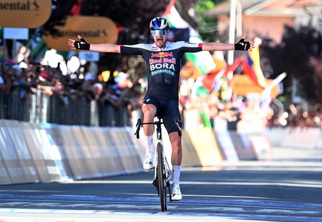 Cycling - Giro d'Italia - Stage 18 - Morbegno to Cesano Maderno - Italy - May 29, 2025 Red Bull - BORA - Hansgrohe's Nico Denz celebrates as he crosses the finish line to win stage 18 REUTERS/Jennifer Lorenzini