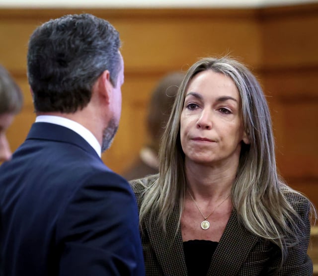 Karen Read speaks with her defense attorney, Alan Jackson, during her retrial in Norfolk Superior Court, Thursday, May 29, 2025, in Dedham, Mass. (AP Photo/Mark Stockwell, Pool) 