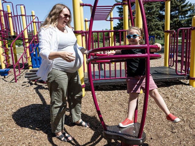 Rustee Tosh and her three-year-old daughter Ellie Tosh play at Weaver Park on a hot sunny afternoon. According to new seasonal forecasts from Environment Canada and Weather Network, a warm, dry summer is expected in much of Saskatchewan. Photo taken in Saskatoon, Sask. on Wednesday, May 28, 2025. (Michelle Berg / Saskatoon StarPhoenix)
